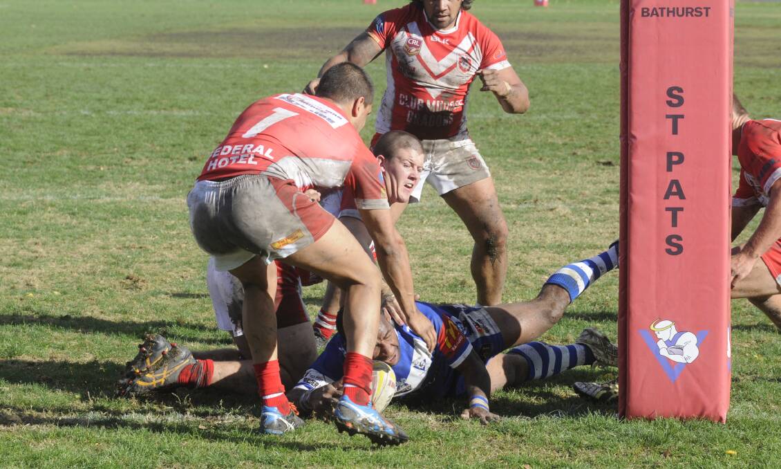 WE’LL TAKE IT: Benjamin John of St Pat’s goes over for a try in their 34-22 win over the Mudgee Dragons yesterday. Photo: CHRIS SEABROOK 050116cpats1