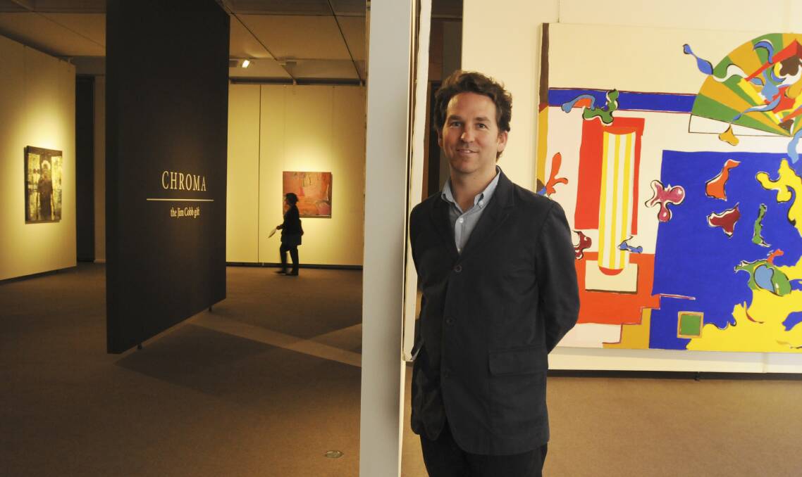 ART FOR EVERYONE: Chroma: The Jim Cobb Gift curator Bradley Hammond with one of the paintings donated to the Orange Regional Gallery by Jim Cobb.
Photo: JUDE KEOGH 0128chroma