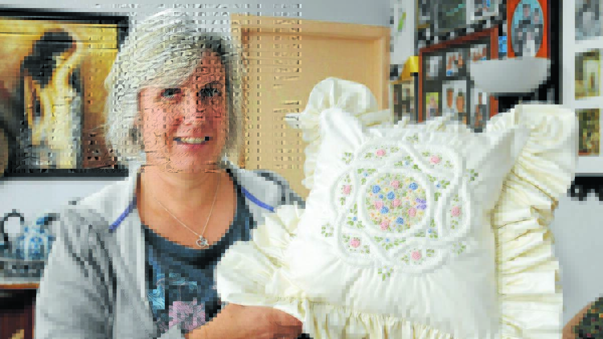 ATTENTION TO DETAIL: Tania Fragar with her hand embroidered cushion cover  that came second at the Orange Show. Photo: JUDE KEOGH                             