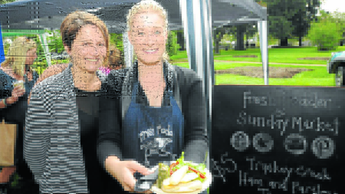 POPULAR PRODUCE: Fresh Fodder’s Jenny Iffland and business development manager Sarah Gillogly, who says yesterday’s event was perfect for showcasing the company’s product range. Photo: STEVE GOSCH                                                                 0406sgproduce10
