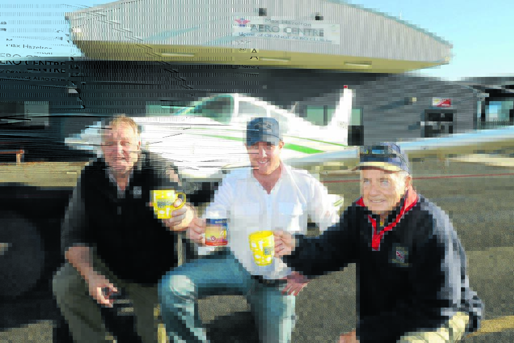 COME FLY WITH ME:  Wade Mahlo, Troy Thomas and Stuart Porges invite people to the Max Hazelton Aero Centre on Saturday morning for a cup of tea. Photo: Steve Gosch	      								                                                                       