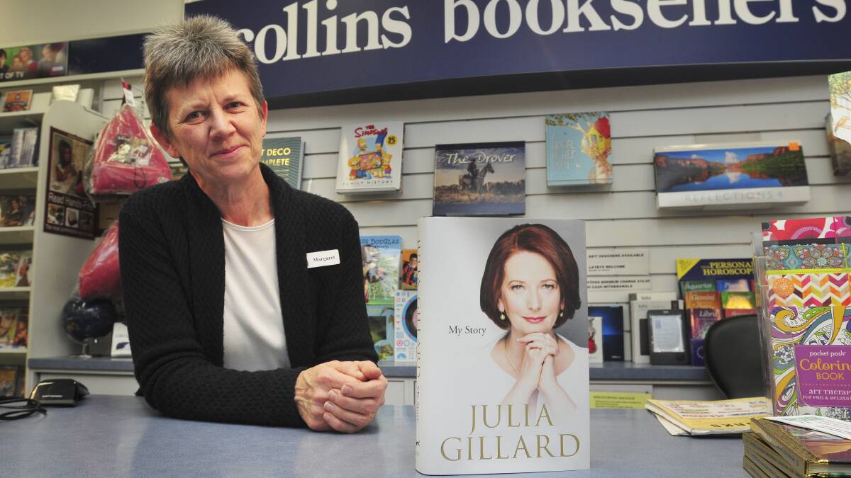 PEN IS MIGHTIER THAN THE SWORD: Owner of Collins Booksellers Margaret Schwebel says the first two orders of former prime minister Julia Gillard’s book sold out within a couple of days.
Photo: JUDE KEOGH    0926gillard1