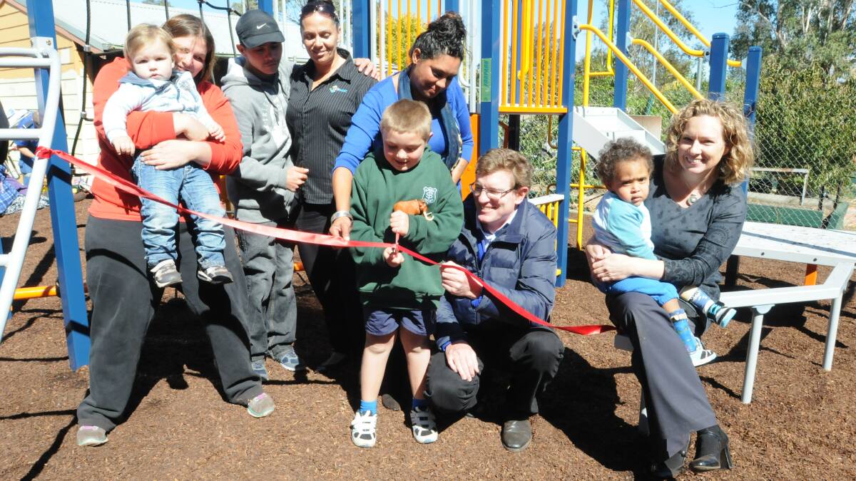 PLAY TIME: Tabitha and Jordan Crowhurst, Terry Hammond, Sharlene Wright, Victoria Barden, Alex Coleman, State member for Orange Andrew Gee, Connor Caelin-Anderson and CareWest community engagement manager Lesa Dunn at the opening of a new playground at Glenroi. Photo: JUDE KEOGH.  