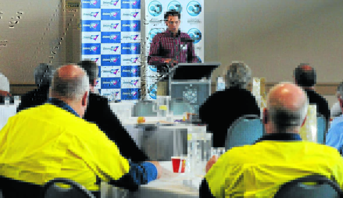 WORKING TOGETHER: Doctor Jess Jennings addresses the crowd at Tuesday’s Central West Jobs Summit including Electrolux human resources manager Geoff Drummond and plant manager Mark O’Kane. Photo: STEVE GOSCH.  
