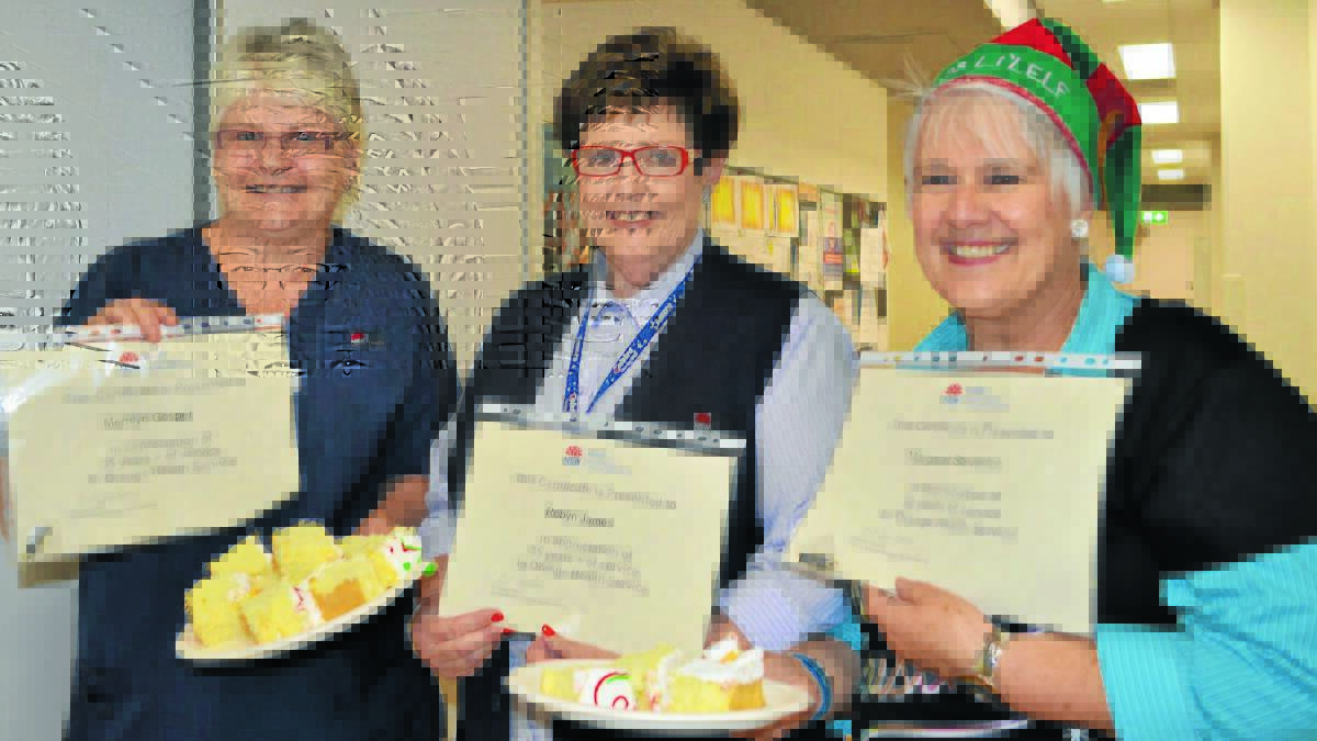 DEDICATED WORKERS: Emergency department registered nurse Merrilyn Gosper, receptionist Robyn James and Maggie Steventon celebrated 41 years, 44 years and 30 years respectively at the Orange Health Service on Friday. Photo: TANYA MARSCHKE                                                                    1212tmlongservice1