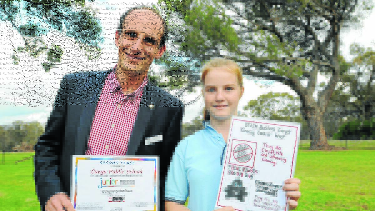 RUNNERS UP: Cargo Public School principal Neil Yeo and Caitlyn Roy with the school’s ad that came second in the Junior Press competition. Photo: STEVE GOSCH.  