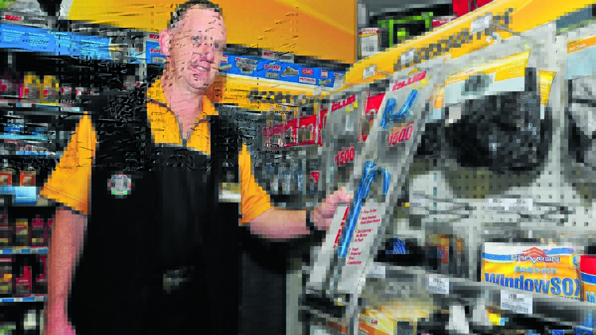 LOCK IT IN TONY: Tony Jackson from Repco says wheel locks are an option for owners of older model vehicles that are being targeted by thieves. Photo: JUDE KEOGH 0708cars
