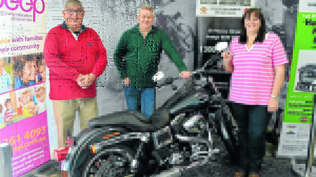 SMOOTH RIDE: Rotary Club of Orange Daybreak ODEEP fundraising committee members Colin Nayda and Peter Roan with Orange District Early Education Program intervention assistant Sharlene Visman raised $25,000 by raffling a Harley-Davidson on Sunday. Photo: TANYA MARSCHKE  
