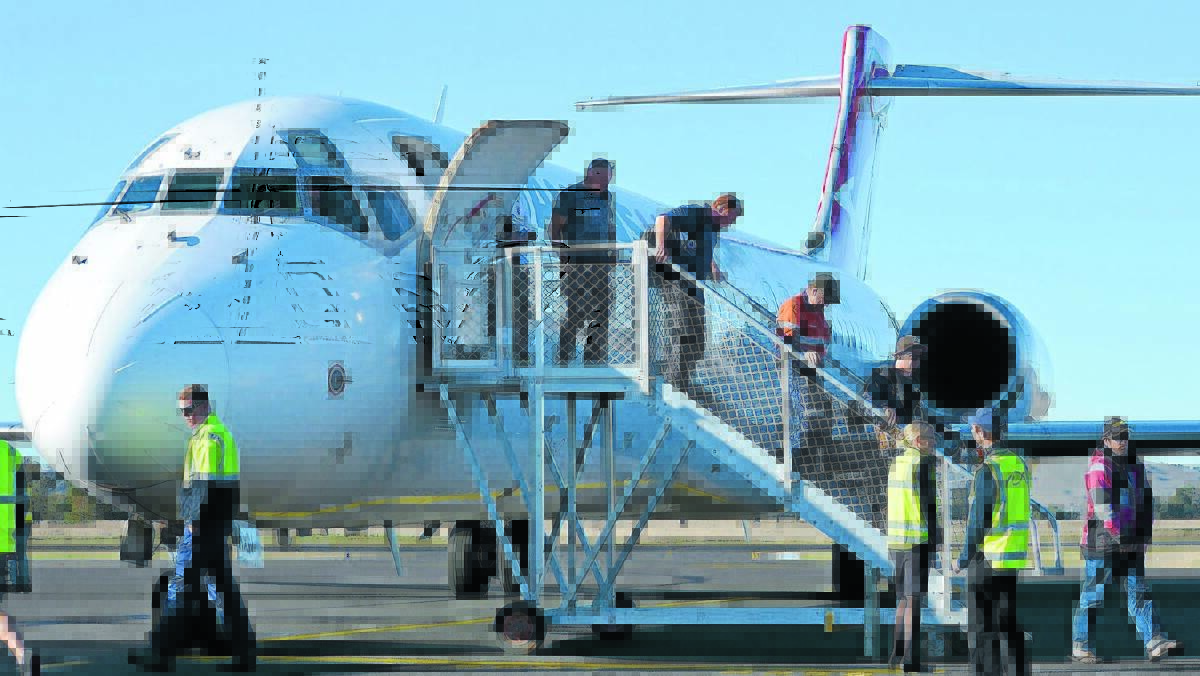 FLYING HIGH: A Boeing 717-200 flew into Orange on Monday to pick up mining crew working in the region. Photo supplied.
