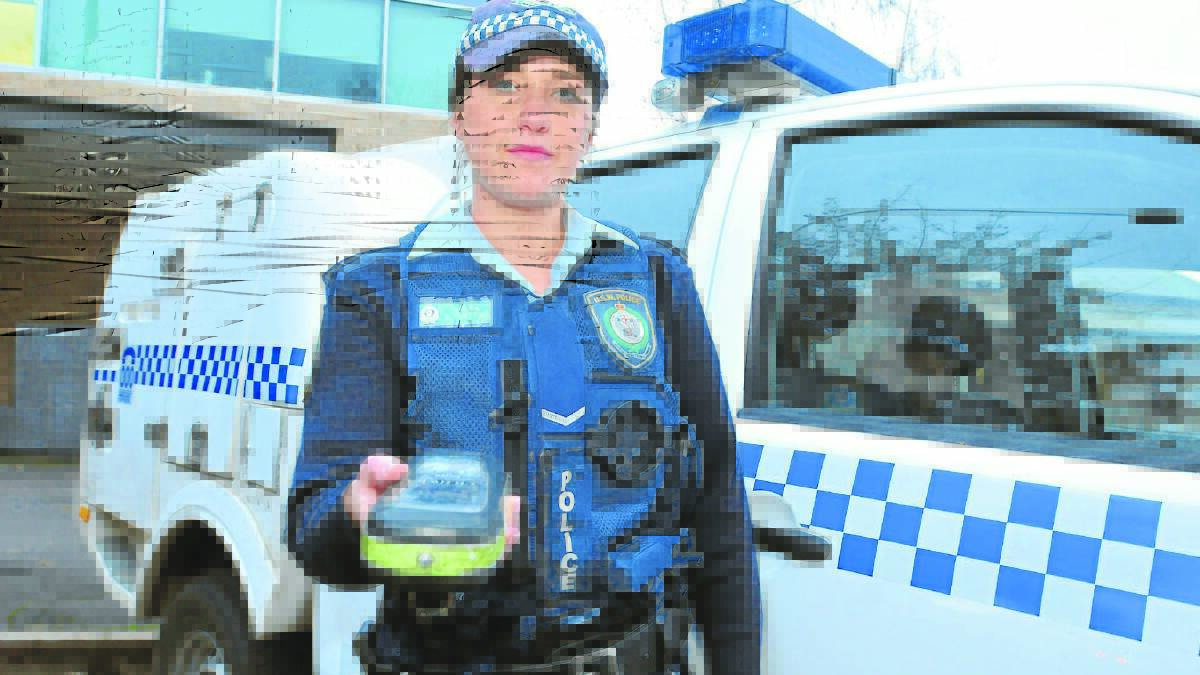 THE MORNING AFTER: Constable Lisa Tarleton warns drivers to think twice about getting behind the wheel the morning after a big night out. Photo: JUDE KEOGH 	                  0625drink2