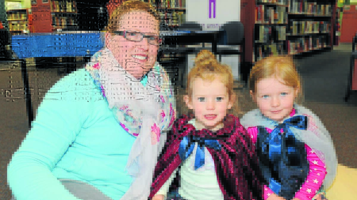 LET THE FUN BEGIN: Orange family Kath, Holly and Abbey Wilkens are looking forward to activities that will be on at the Orange City Library these school holidays. Photo: STEVE GOSCH 0918sgstory1
