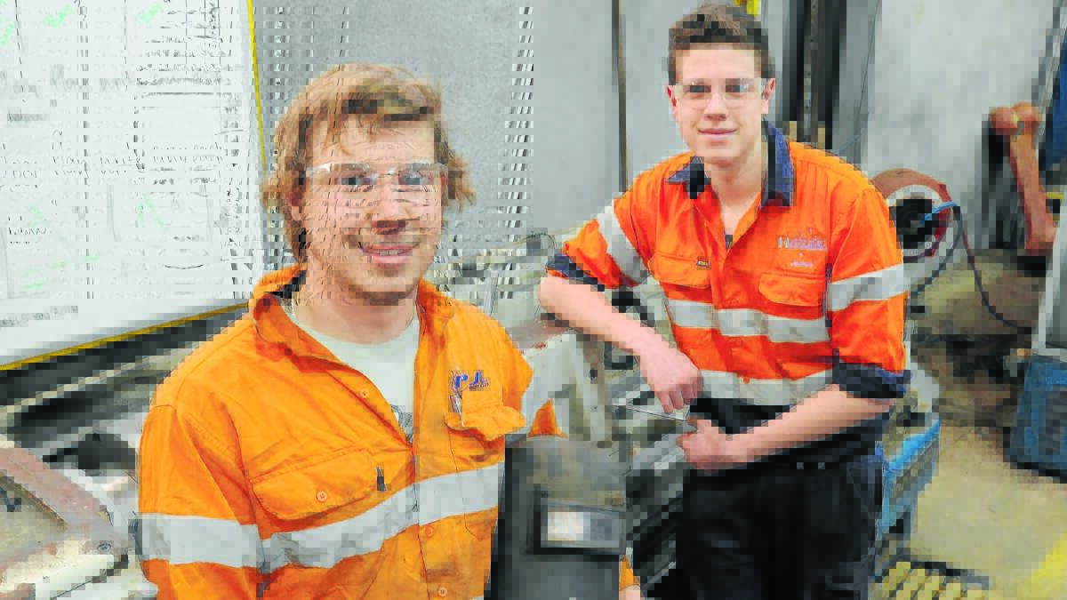 TRICKS OF THE TRADE: Brothers Nathan and James Kelly will take their skills learned on the job and compete in the WorldSkills Australia compeition in September. Photo: STEVE GOSCH                                                                                                                                             0730sgtrade