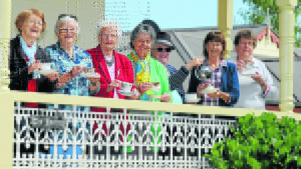 COME ON IN: Holy Trinity Anglican Church parishioners Elaine Penhall, Dorothy Brown, Dorothy McKeon, Ann Holden, Lyn Atkins, Tina Mills and Brenda Wright look forward to touring the public through the church’s rectory tomorrow. 
Photo: STEVE GOSCH 1017sghightea2
