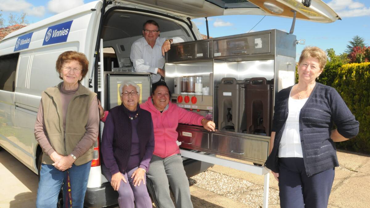 HELPING THE POOR: Orange’s volunteers Maria Mate, Monica, Knight, Rosie Frecklington and Anne-Marie Bobin with John Oldroyd (back) have worked over the last few years to prepare and distribute food to the disadvantaged. 
Photo: JUDE KEOGH

