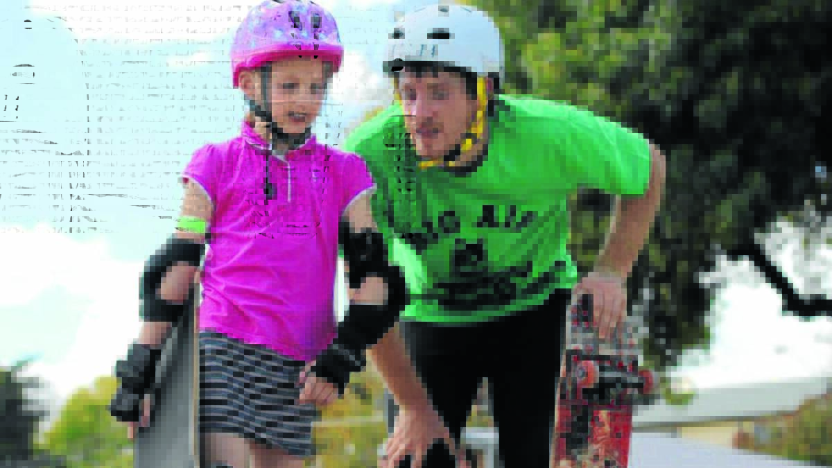 TAKING IT ON BOARD: Ada Gilbody-Esterbauer gets a few tips from Big Air School pro skater Jesse Robertson at last year’s event.