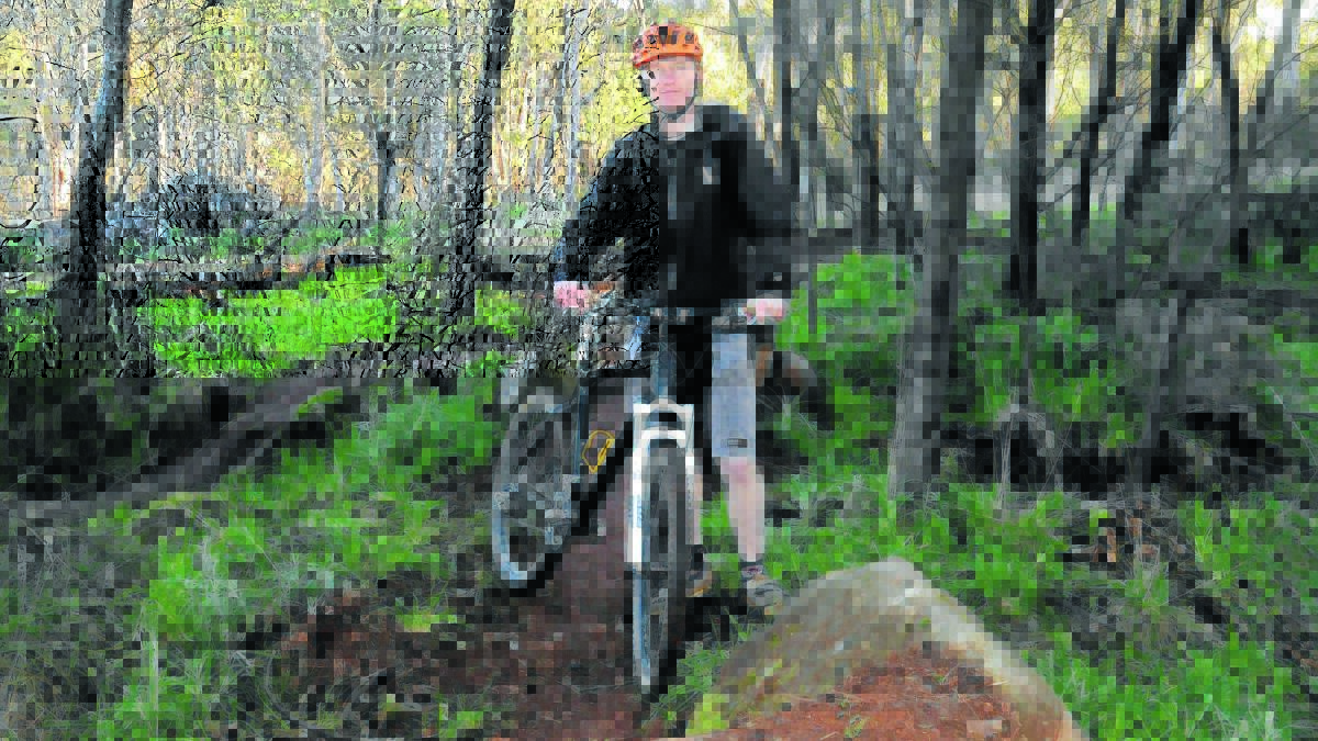 TRACK ON TRACK: Central West Off Road Bicycle Club treasurer Grant Dowell says part of the Lake Canobolas bike track could be ready by the end of August. Photo: LUKE SCHUYLER                                                        0704lsbiketrack4
