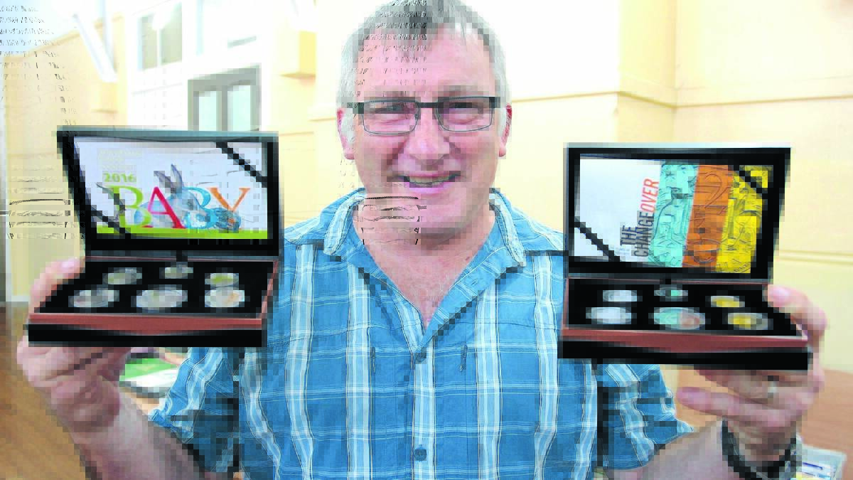 COLLECTORS ITEMS: Rob Willis with a collection of old coins at the monthly Orange Coin and Stamp Club fair on Saturday. Photo: STEVE GOSCH						             
