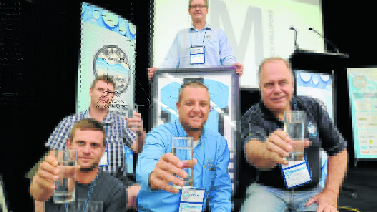 GOOD DROP: Justin Miller (Tamworth Council), Keith Hyatt (Bega Valley Shire Council), Geoff Warren (Orange City Council) and Bill Palmer (Port Macquarie-Hastings Council) are compete in the NSW best tasting water contest tomorrow with Anthony Cavenagh of Ixom who’s holding the trophy. 
Photo: STEVE GOSCH 
