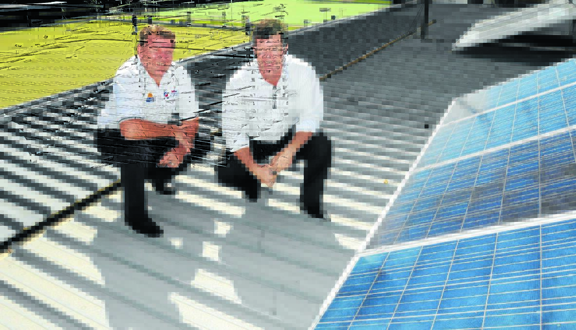THE FUTURE IN MIND: Solar Co commercial projects manager Reg Henderson with Orange City Bowling Club secretary manager Michael Gray with the club's new solar panel system which they hope will help keep them viable. Photo: STEVE GOSCH                                                                                                                0303sgsolar2