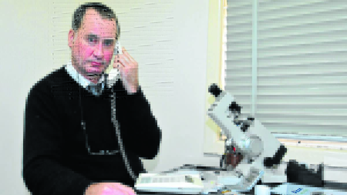 NOT SEEING EYE TO EYE: Optometrist Gary Clothier lost his phone service on May 2. 
Photo: LUKE SCHUYLER  0509lsoptom