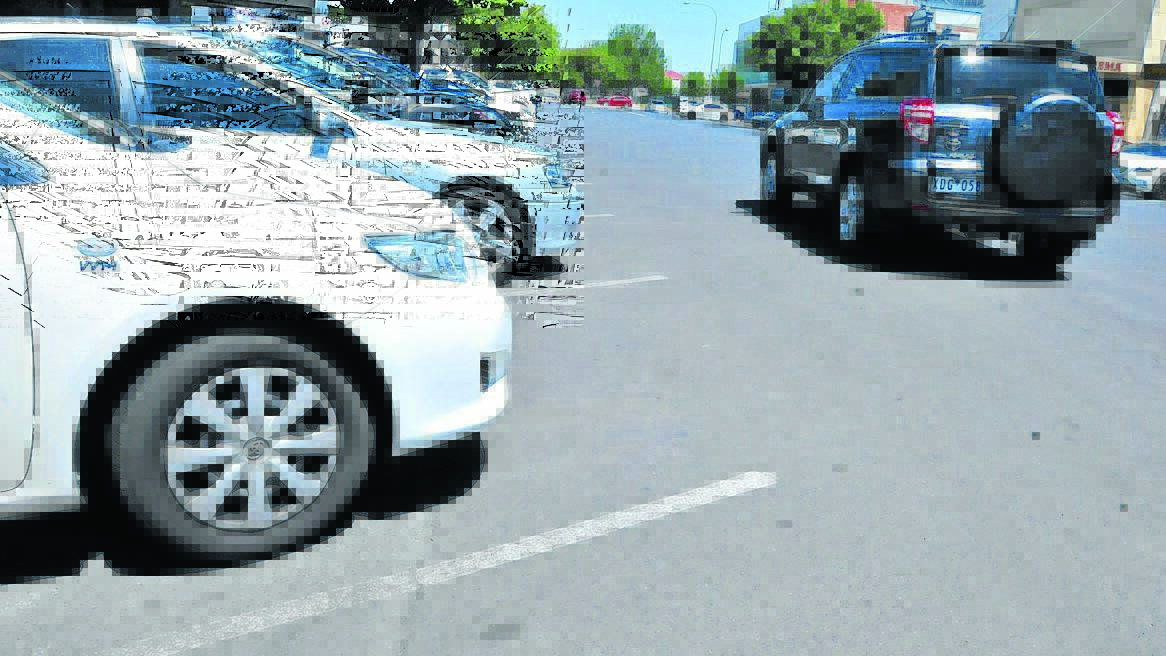 WHITE LINE FEVER: Cr Glenn Taylor wants the lined parking spaces in Lords Place rolled out in other CBD streets as part of an overhaul to the city’s parking. Photo: JUDE KEOGH                         0207lordslines1
