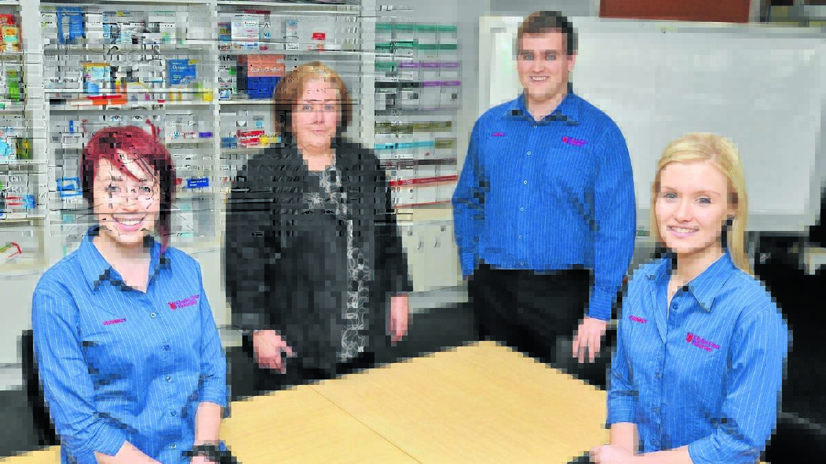INCREASED ENROLMENTS: Charles Sturt head of campus Heather Robinson with fourth year pharmacy students Damian Lewis (back),  and   Akira Hobson and Ellie Butina (front). Charles Sturt University pharmacy student numbers will spill when the university pharmacy course closes in Wagga Wagga. Photo: JUDE KEOGH.