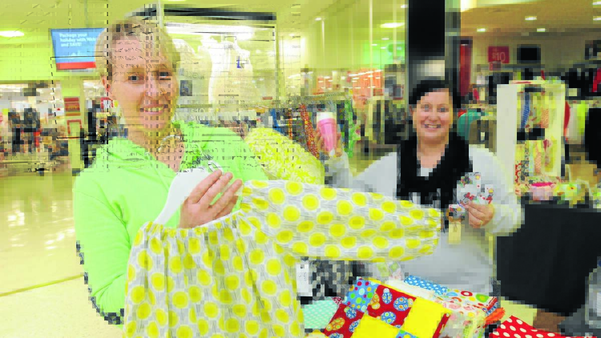 COLOURFUL CREATIONS: Kerry Rodwell and Karina Gowen were busy spruiking the mini monthly craft market at the Orange City Centre on Friday. 
Photo: STEVE GOSCH 	          
