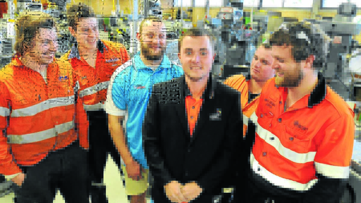 BEST IN THE WEST: Kieran Muldoon tries on his new jacket as Nathan Kelly, James Kelly, Lyle Davis, Reece Bennett and Pete Johnson look on ahead of the WorldSkills Australia National Competition on September 18. 
Photo: STEVE GOSCH 0829sgworldskills1
