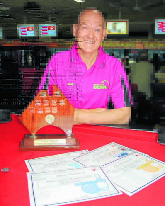 STRIKE FORCE: Orange's David Hayward shows off his awards from the 2015 National Deaf Tenpin Bowling Championships. Photo: MICHELLE COOK 