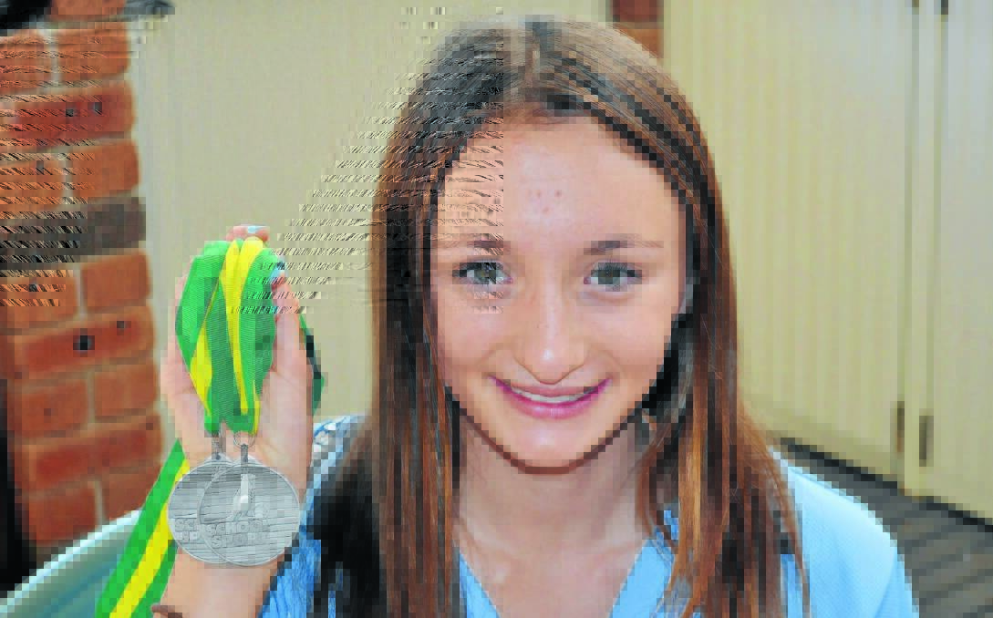 MEDAL DOUBLE: Despite battling foot injuries, Orange's Lauren Kerwick earned two silver medals at last week's School Sport Australia triathlon championships. Photo: MATT FINDLAY 0414mfkerwick.
