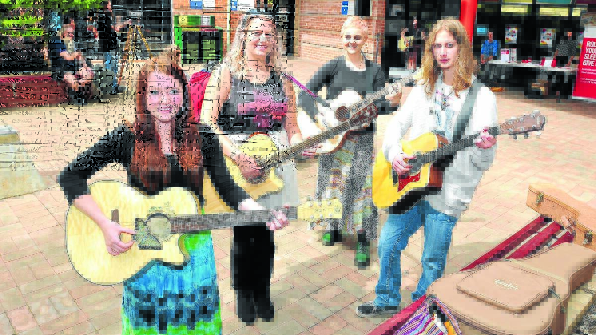 SINGING PRAISE OF COLLEGE: Samantha Jean, Ellen Blair, Haylee Gallagher and Kaleb Morrow entertaining at TAFE’s celebration of Youth Week and library transformation. Photo: JUDE KEOGH