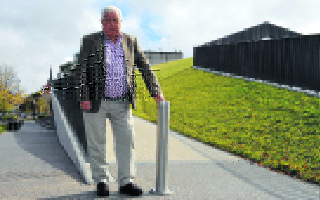 SLIPPERY SLOPE: Councillor Ron Gander believes people will treat the new grass roof above the Orange Regional Museum with a sense of pride. Photo: BRYSON FERREIRA 