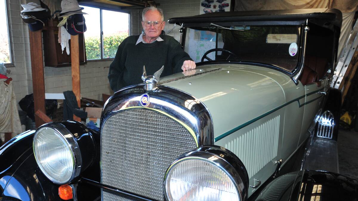 PRIDE AND JOY: Jim Coomber with his magnificent 1928 Chrysler which took him 40 years to restore. Photo LUKE SCHUYLER