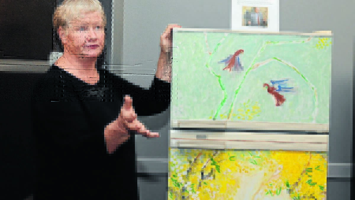 DOOR PRIZE: Judith Pugh speaks to the crowd at the auction about the fridge painted by her husband in the late 1950s which was auctioned. Photo: JUDE KEOGH  