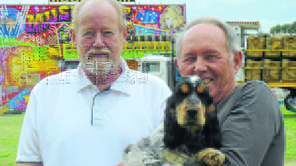 CHARLIE’S ANGELS: International all dog breeds judge Gary Doyle from New Zealand and dog section steward Don Mahoney holding cocker spaniel Charlie are looking forward to this weekend’s Molong Show. Photo: CONTRIBUTED