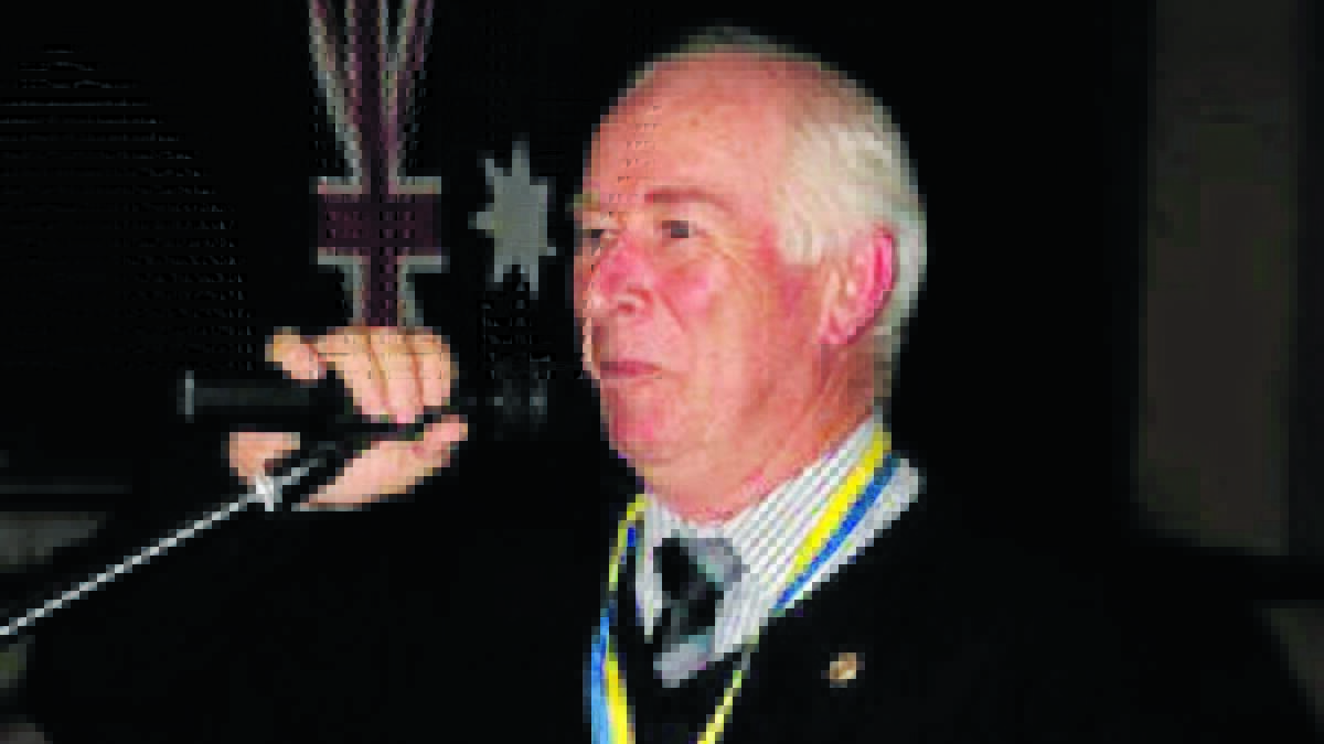 WHAT AN HONOUR: Mick Doyle is named a Paul Harris Fellow at the Rotary Club of Orange’s changeover dinner. Photo: CONTRIBUTED