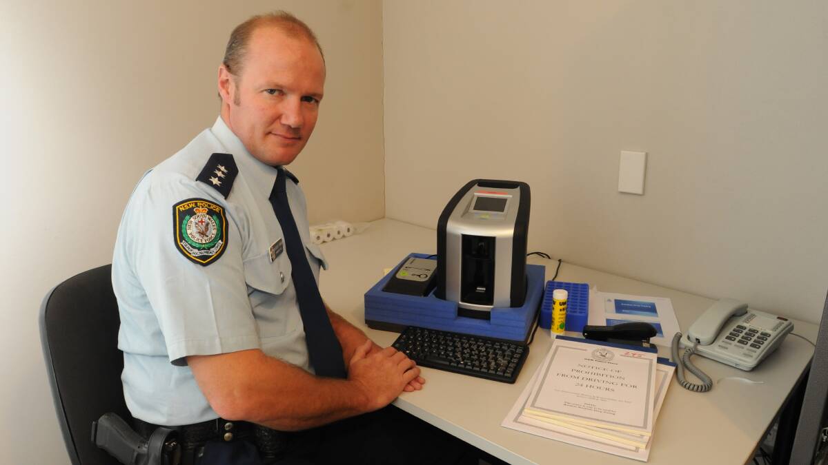 WE HAVE THE MEANS: Canobolas Local Area Command Acting Inspector Brendon Turner with Orange police station’s new Draeger drug test 5000 device that will be used to conduct random drug tests in the region. Photo: JUDE KEOGH
