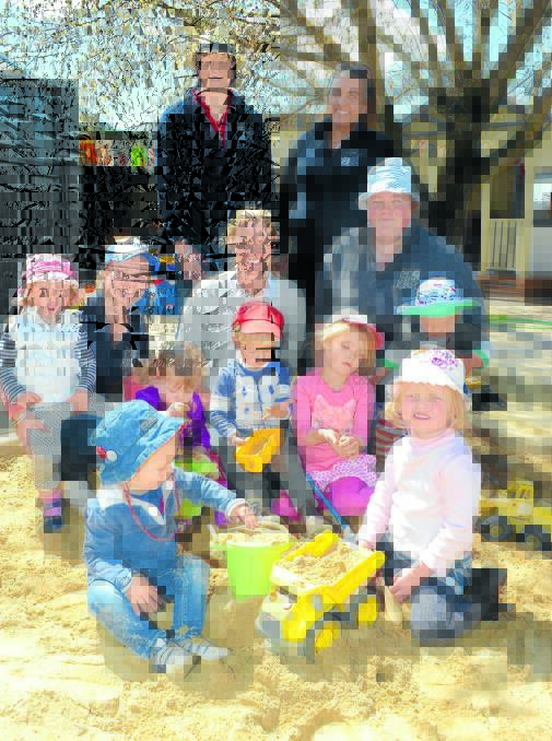 FULL STEAM AHEAD: Molong Early Learning Centre staff and children, back, Sharnie Duncan, Tamika Gallagher. Middle row, Georgie Bowman, Emily Aveyard, Kate Strahorn, Laura Parmeter. Front, George Packham, Reba Phillpot, Nicholas Strahorn, Zoe Strahorn, Jack Toynton and Lucy Toynton. Photo: JUDE KEOGH  
