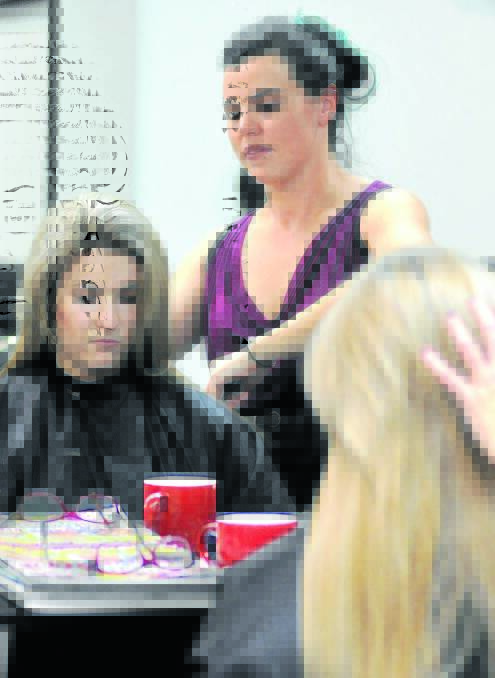 TWO FOR ONE SERVICE: Hairdresser at Iko Iko Hair in Orange Jess Lamrock says she always looks for moles and melanomas on her clients like Jacq Boulton (pictured) and urges them to see a doctor if she notices any abnormalities. Photo: STEVE GOSCH   