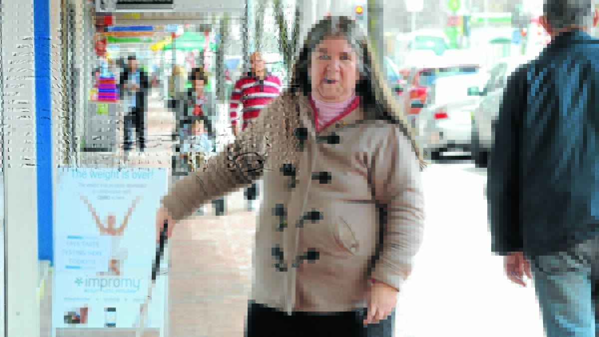 ACCIDENT POTENTIAL: Aging and Access Community Committee member Donna Holland says sandwich boards, or A-frame signs in front of Orange shops could be a dangerous trip hazard for people with vision and movement impairments. Photo: JUDE KEOGH 
