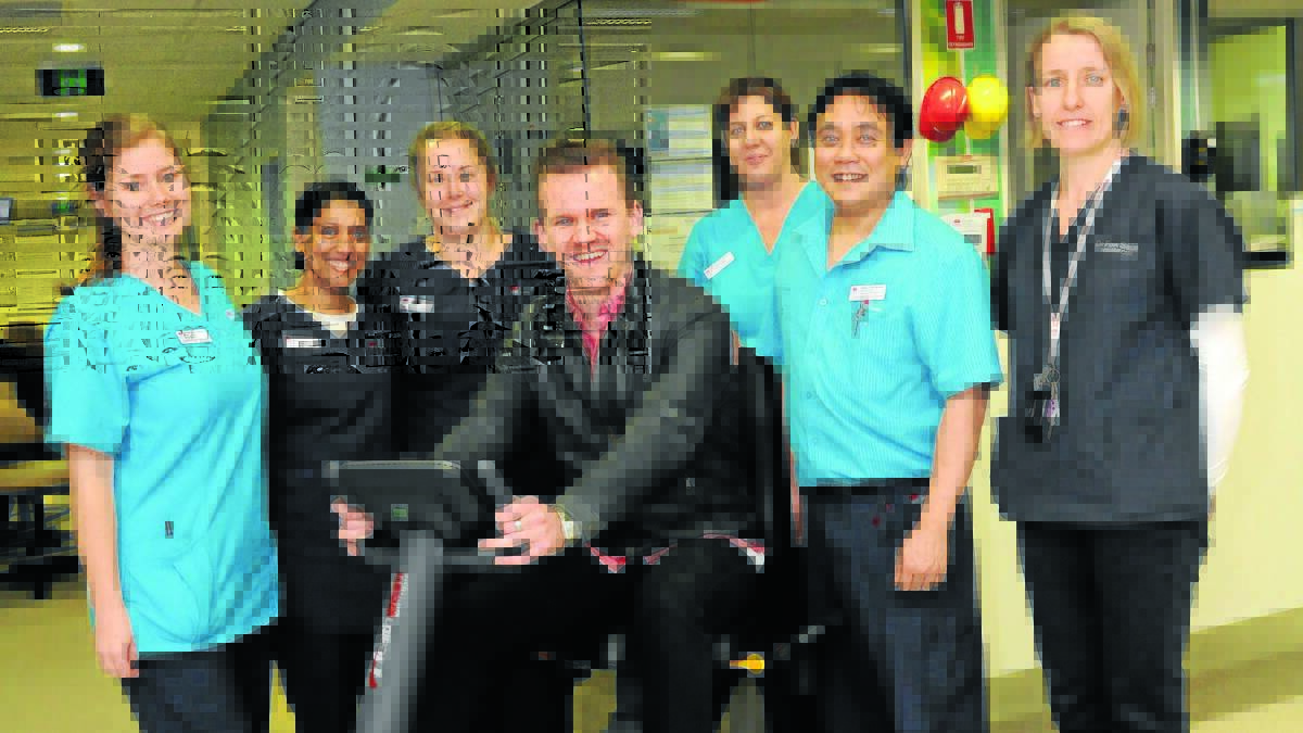 FULL RECOVERY: Jamie Saunders with physiotherapist Emma Warby, intensive care nurse Susan Mathew, clinical nurse consultant Zoe Bolus, physiotherapy assistant Raelene Carman, acting head of physiotherapy Peter Young and head of intensive care Dr Fiona Shields who helped Mr Saunders through his recovery in intensive care.
Photo: STEVE GOSCH 0916sgrehab2