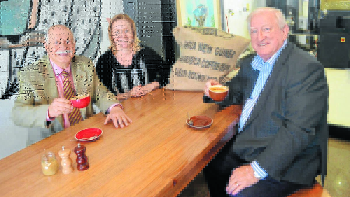 COFFEE SHOP RUMOURS: Deputy mayor Chris Gryllis, Factory Espresso co-owner Lisa Parianos and mayor John Davis discuss sourcing Mount Hagen coffee to stimulate its economy.
Photo: DANIELLE CETINSKI  0910dccoffee1