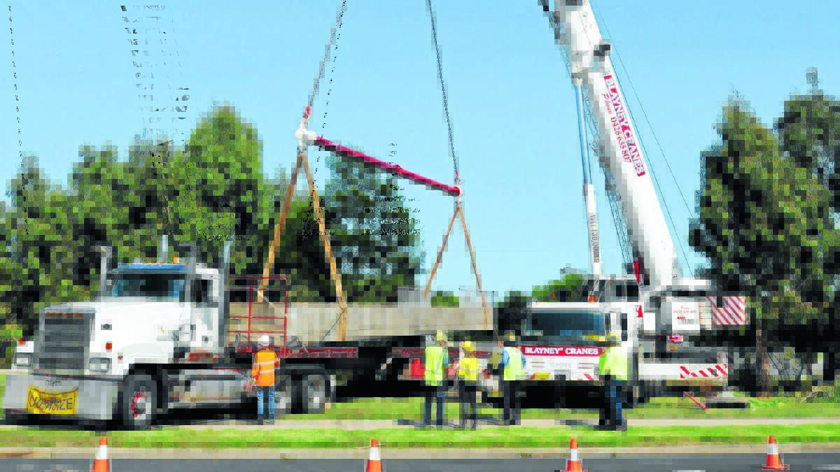 CRANING FOR A LOOK: Two large two cranes were used to transport the bridge.