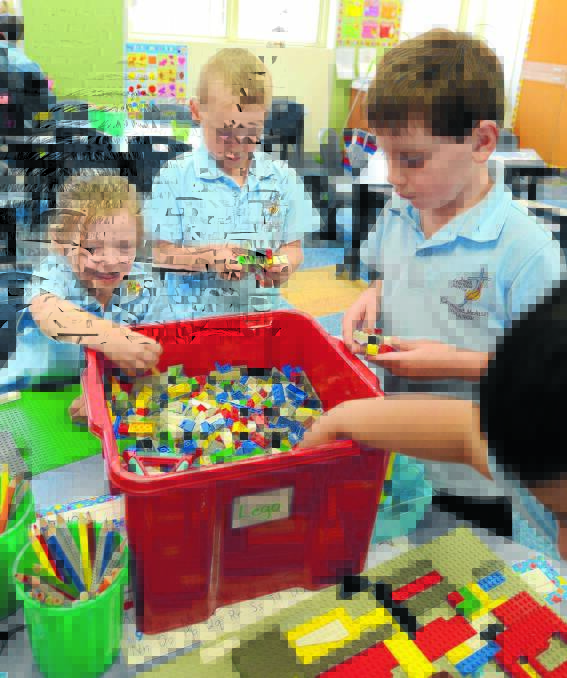 READY TO LEARN: Jayde Lewis, Cooper Murray and Ben Mulhall are among the new students to start kindergarten at Catherine McAuley Catholic Primary School this year. 
Photo: STEVE GOSCH  
