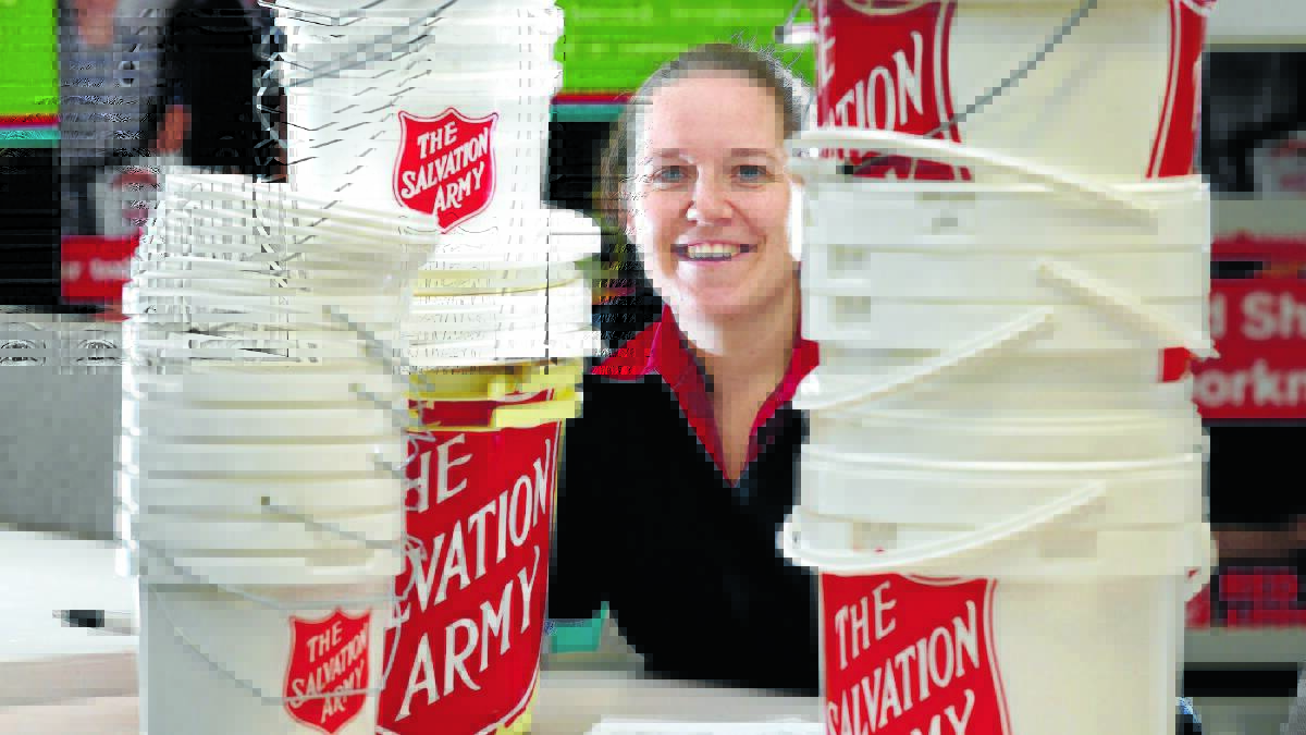 STACKS OF GENEROUS PEOPLE: Salvation Army captain Tahlia Grounds is pleased by this year’s Red Shield Appeal collection in Orange. Photo: PHIL BLATCH  

