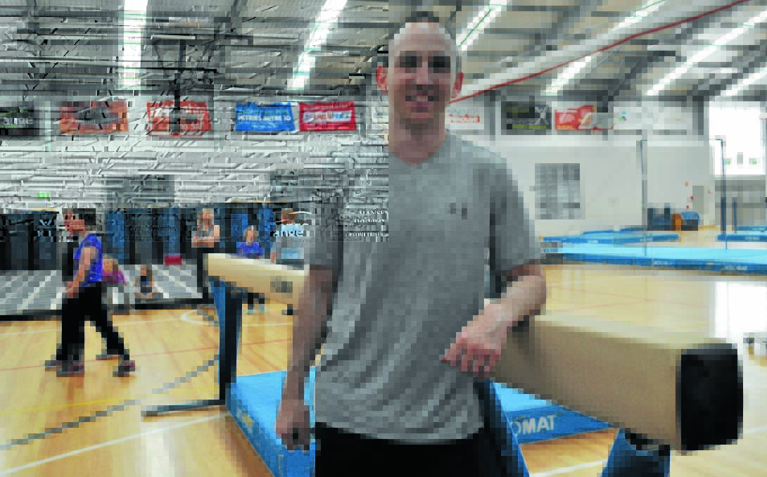 BEAMING: Gymnastics NSW events manager Chris Martin on Wednesday during set-up for the championships, was excited about the coming four days of competition. 
Photo: NICK McGRATH  