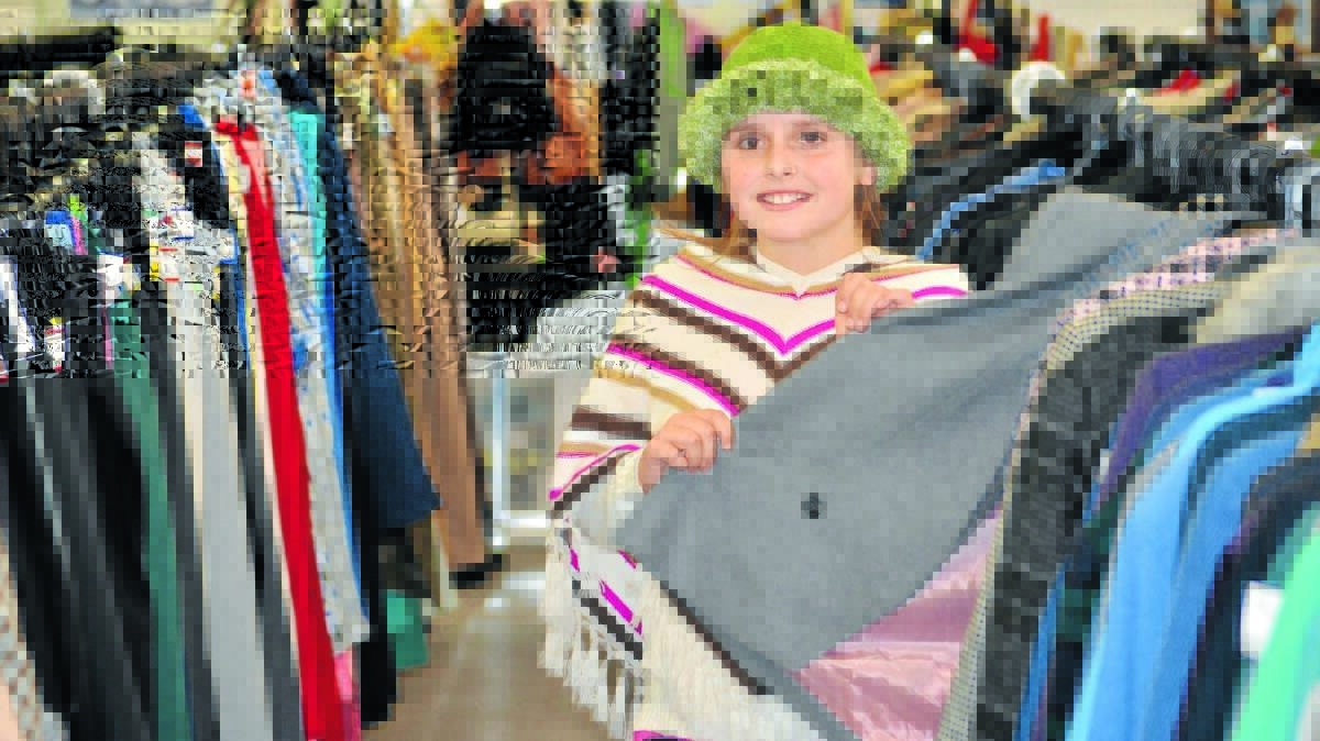 GIVE THOUGHTFULLY: Salvation Army Family Store volunteer Hope Webb is calling on people to donate jackets, warm pants, jumpers and blankets to help those in need cope with the cold. Photo: NICOLE KUTER 0702nkcharity4