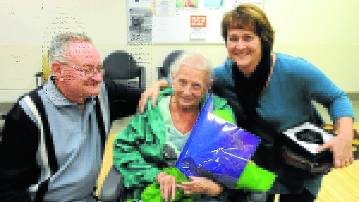 NURSE OF THE YEAR: Linda Harvey (right) with one of her patients Yvonne Cobram and her husband Mick who announced Mrs Harvey’s nurse of the year award at Orange hospital on Wednesday. 
Photo: STEVE GOSCH 0507sgnurse2