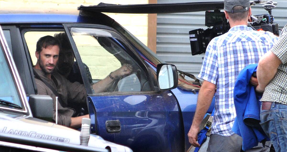 NO TIME WASTING: Filming of the movie 'Strangerland' kicked off in Canowindra on Friday, with actor Joseph Fiennes at the wheel. Photo: Steve GOSCH