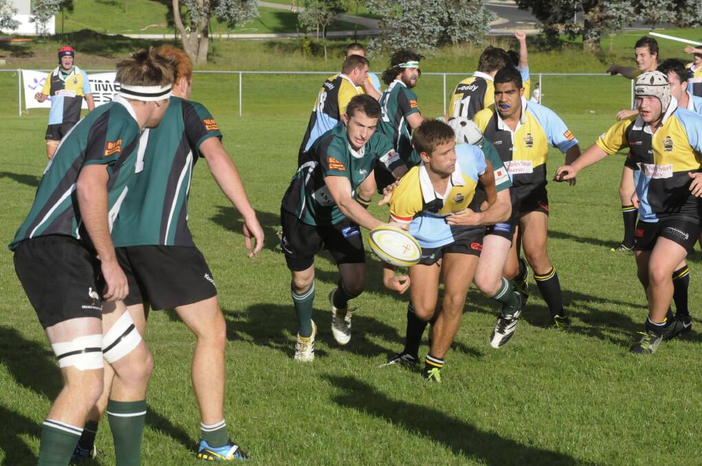 STILL SEARCHING: CSU centre Tom Keft tries find a team-mate in support during their match against Orange Emus. While the students did not get the points from that match, they are hoping to open their account against Mudgee tomorrow. Photo: CHRIS SEABROOK 041214csu2